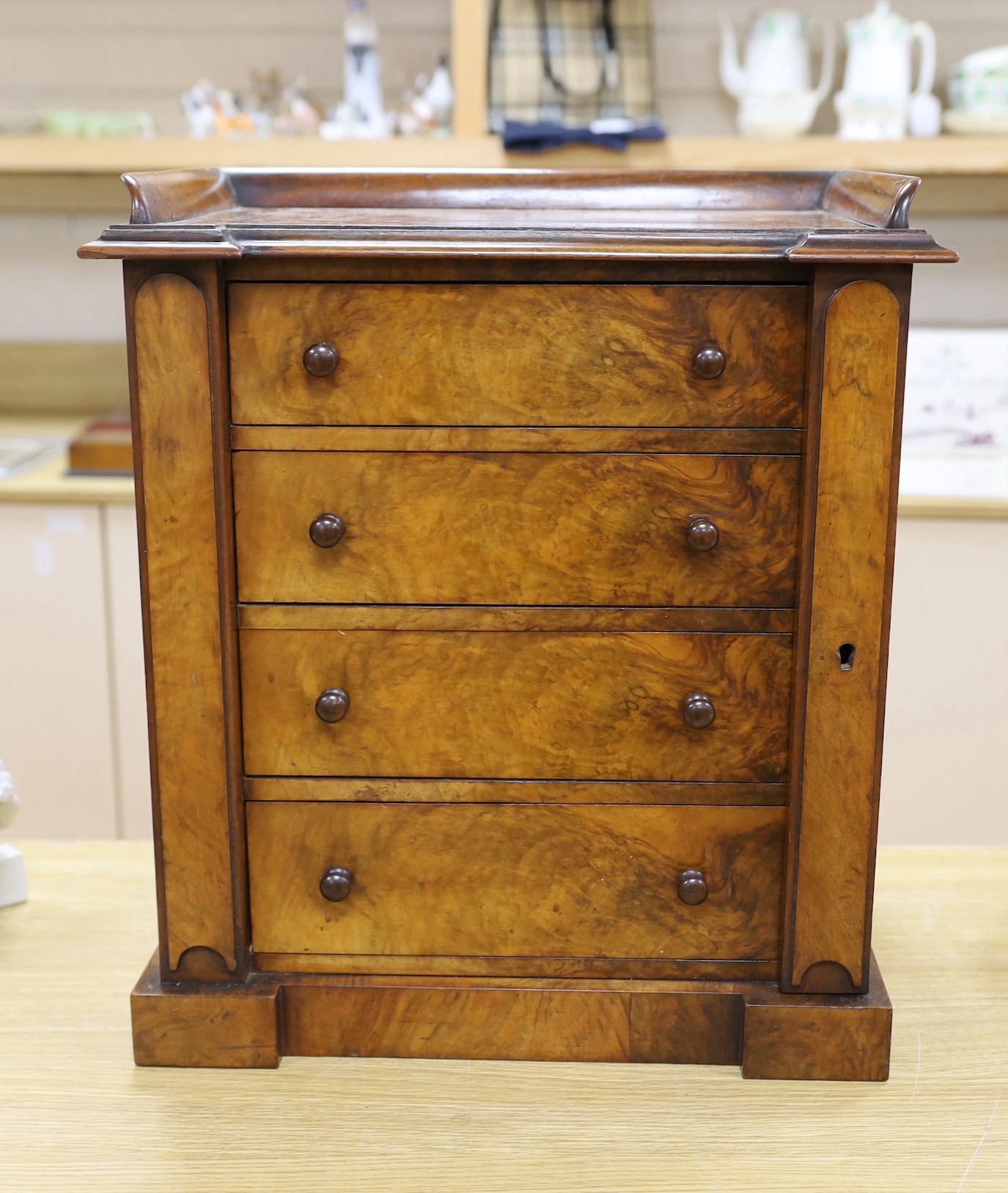 A Victorian figured walnut table top Wellington collector’s chest, 51 cms high x 43 cms wide